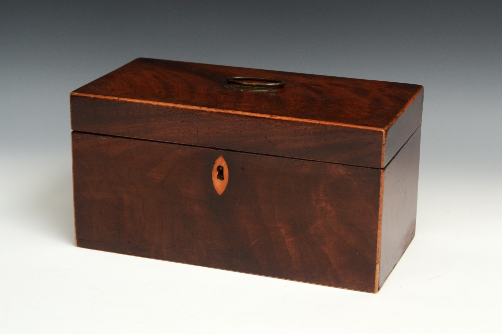 A George III mahogany rectangular tea caddy, hinged cover with Sheffield plate navette shaped