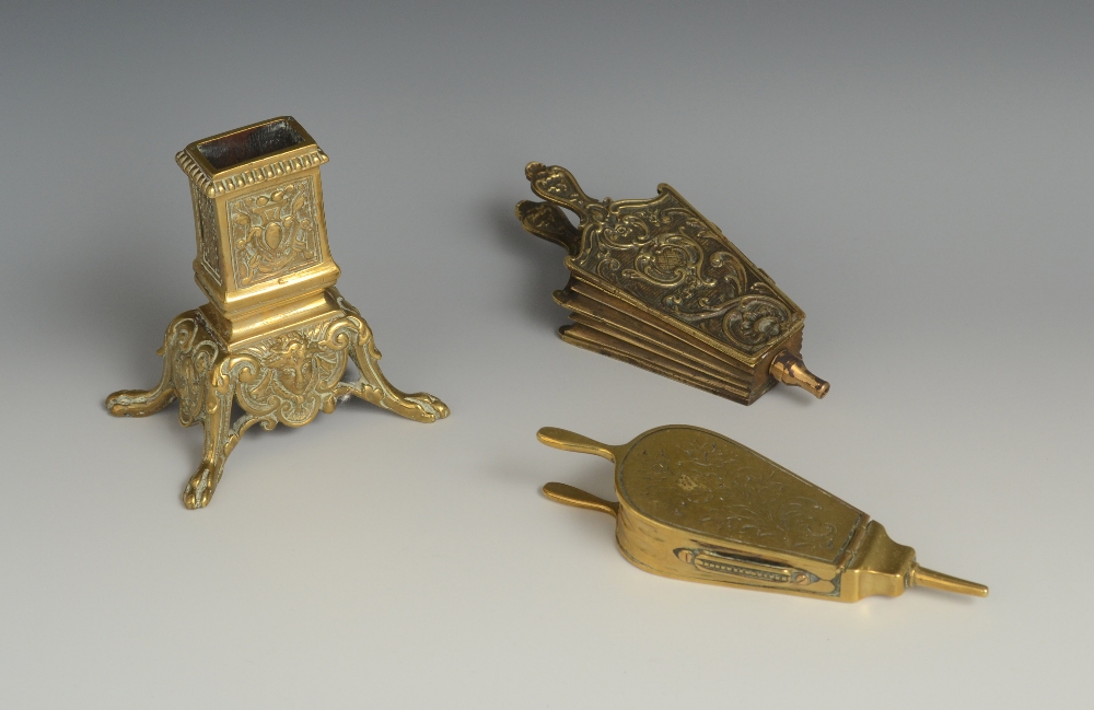 A 19th century cast brass novelty vesta box, as a pair of bellows, the hinged cover engraved with