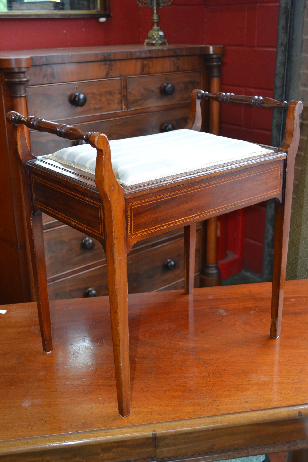 An Edwardian music stool, boxwood and ebony inlay, square tapered legs, constructed from mahogany