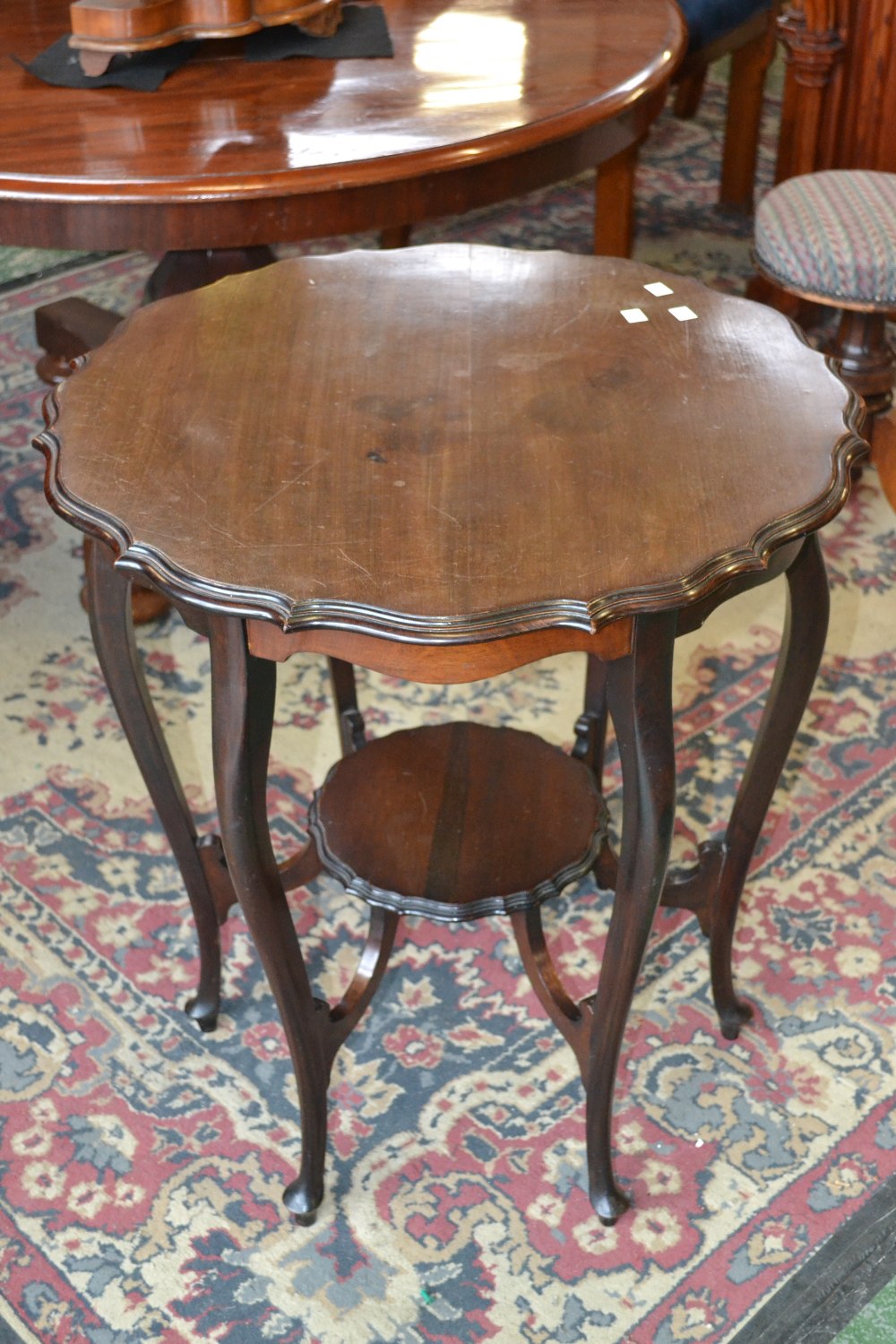 A mahogany piecrust table