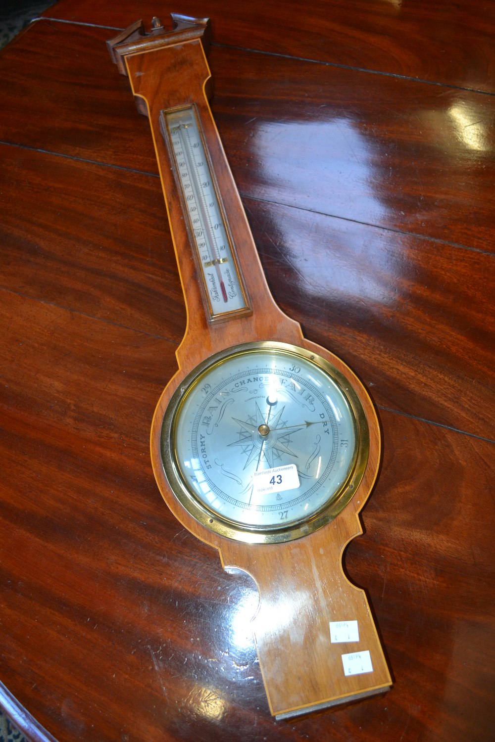 A George III style wheel barometer, outlined with boxwood stringing, modern