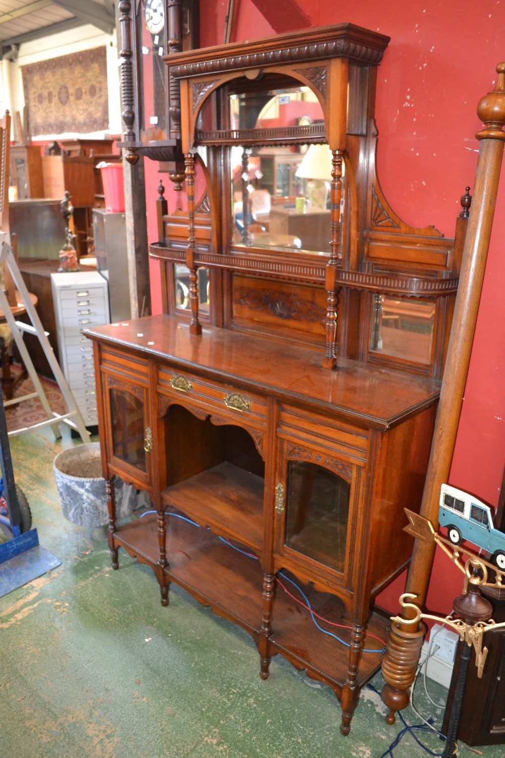 A Victorian mahogany mirror backed sideboard, stepped cornice above an arrangement of mirrors and