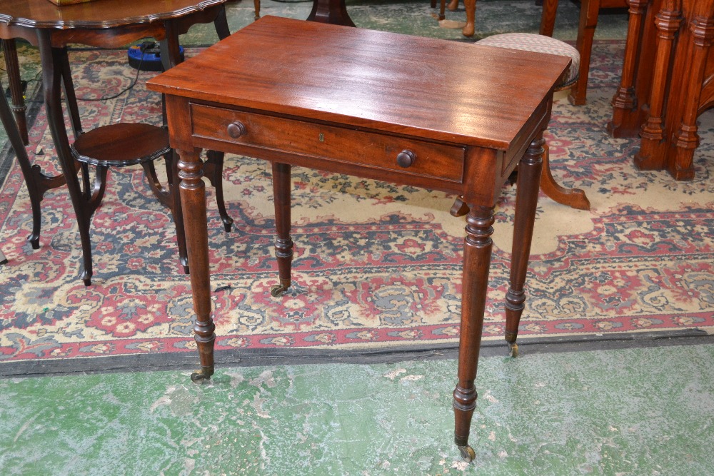 A late Regency mahogany side table, with turned supports