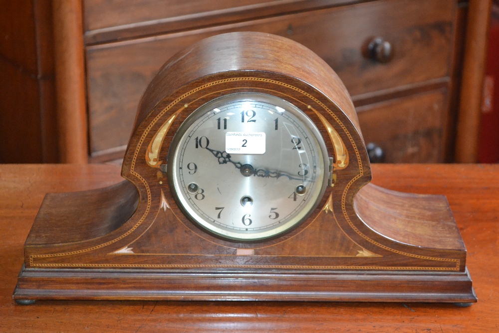An Edwardian mahogany mantel clock with Mother of Pearl inlay