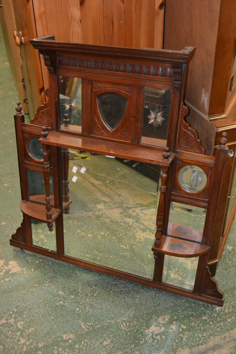 A Victorian mahogany overmantle mirror, with decorative mirrored panels