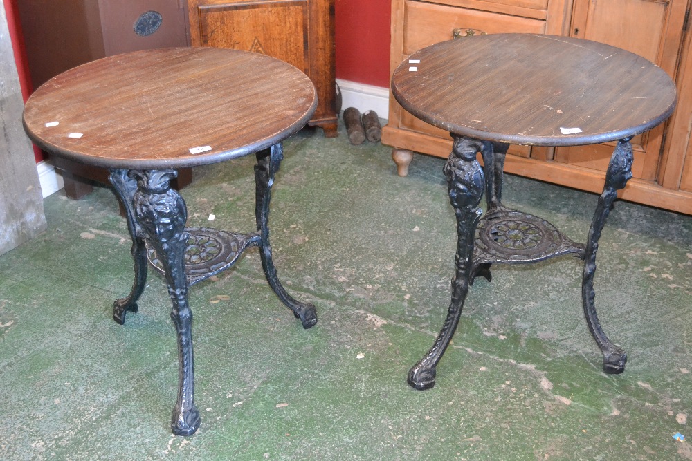 A pair of decorative pub tables