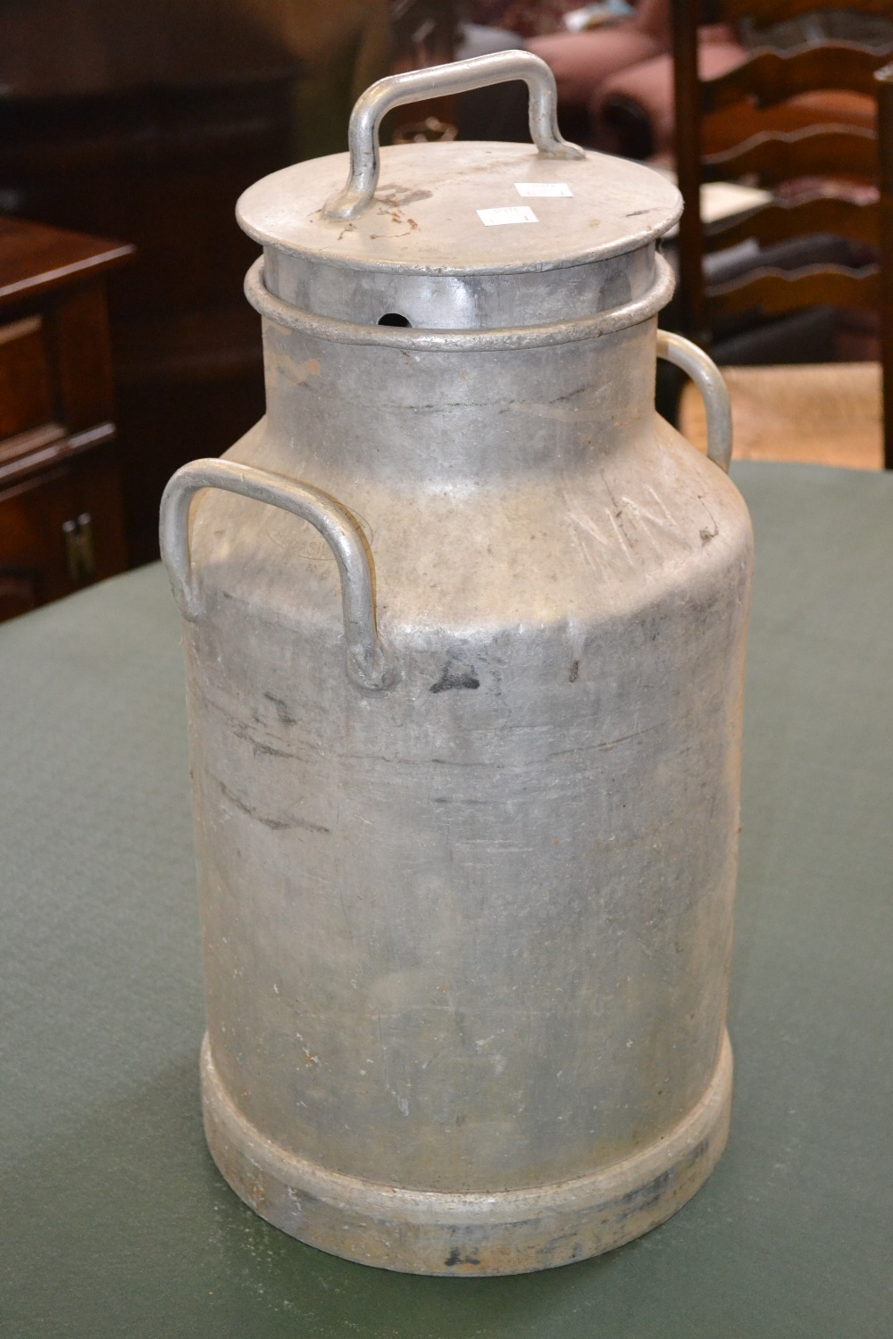An aluminium milk churn, marked "Hugannet Almasilium, Dijon