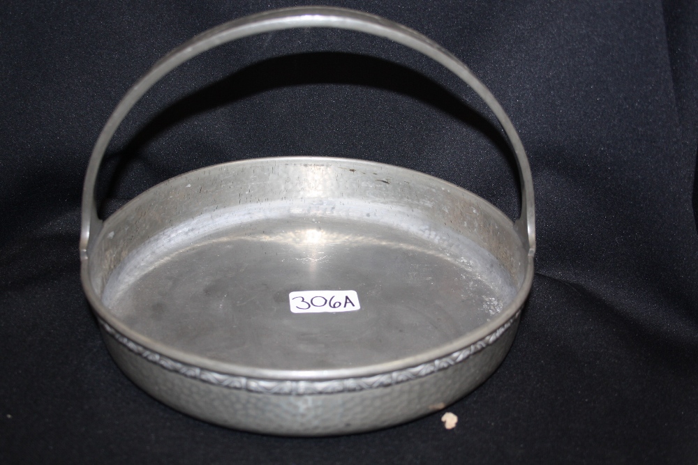 Liberty & Co - an Art Nouveau Tudric pewter circular basket, plain shed and embossed with stylised