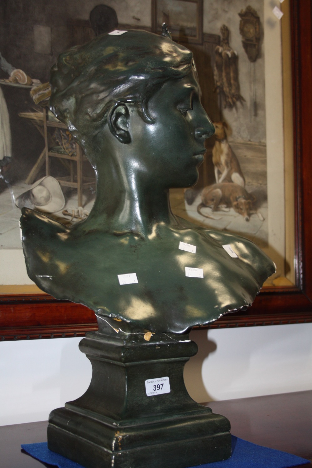 A large green coloured plaster cast bust of a beauty