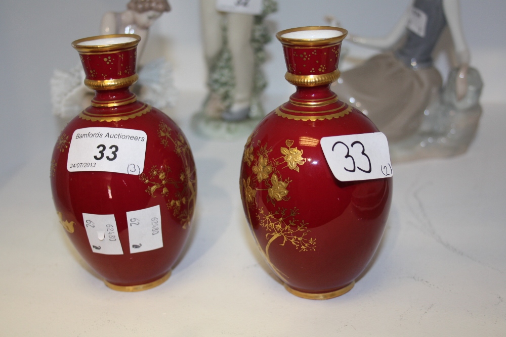 A pair of Royal Crown Derby red and gilt vases