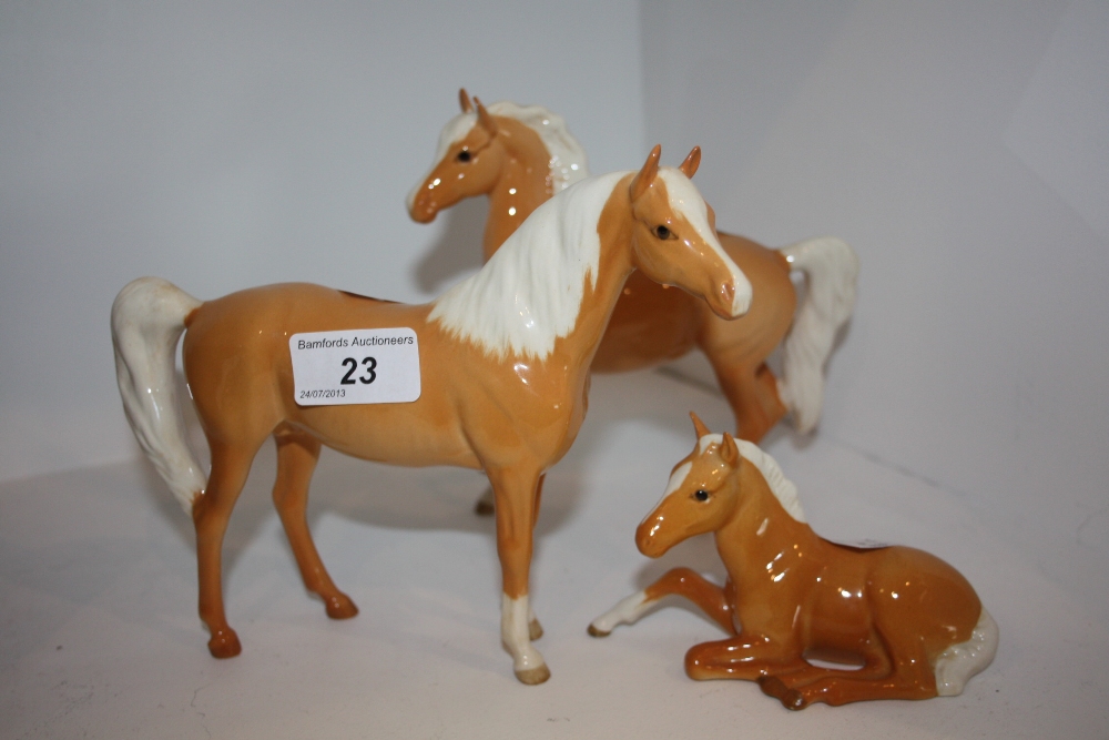 A Beswick Palomino horse; another; a foal (3)