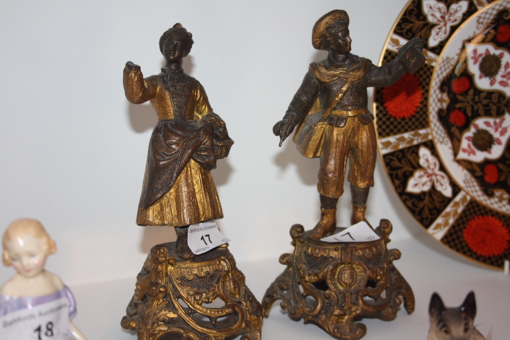 A pair of  early 20th century cast spelter figures as a man and woman c.1900