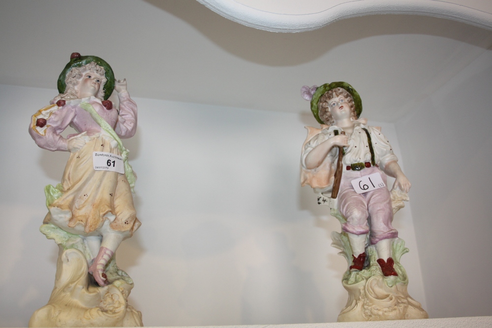 A pair of bisque porcelain figures c.1900