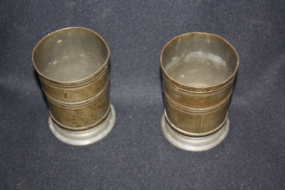 A pair of 19th century pewter half pint measures