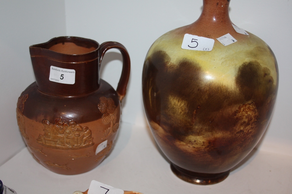 A Doulton Lambeth salt glazed jug; a printed ovoid vase (2)