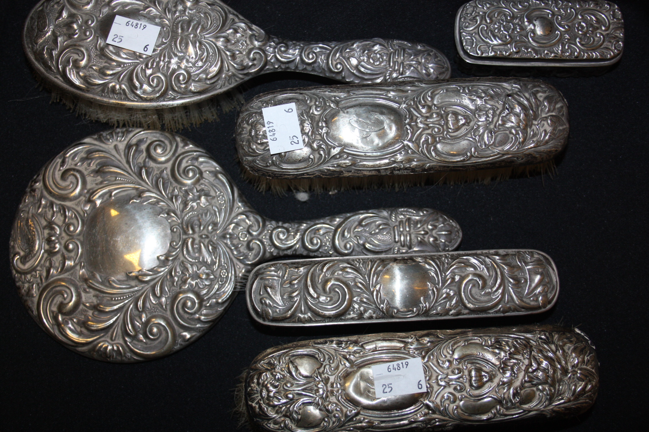 A silver backed dressing table set, including hand mirror, brushes, trinket dish, Birmingham (6)