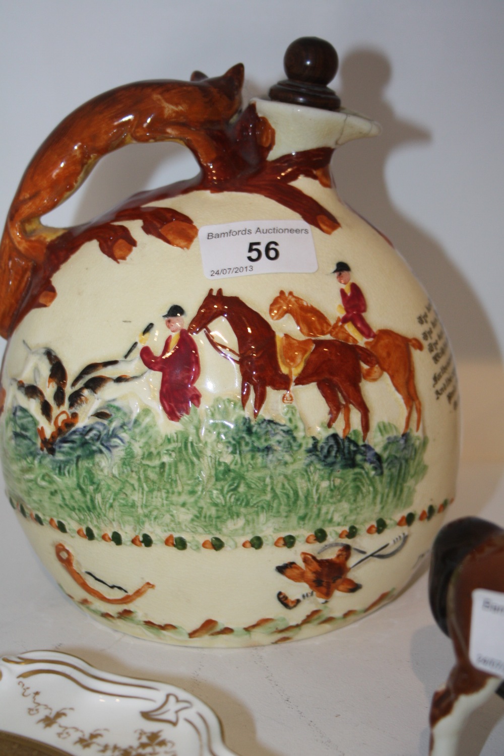 A nineteenth century `John Peel` musical ceramic jug, with fox handle, decorated with hunting