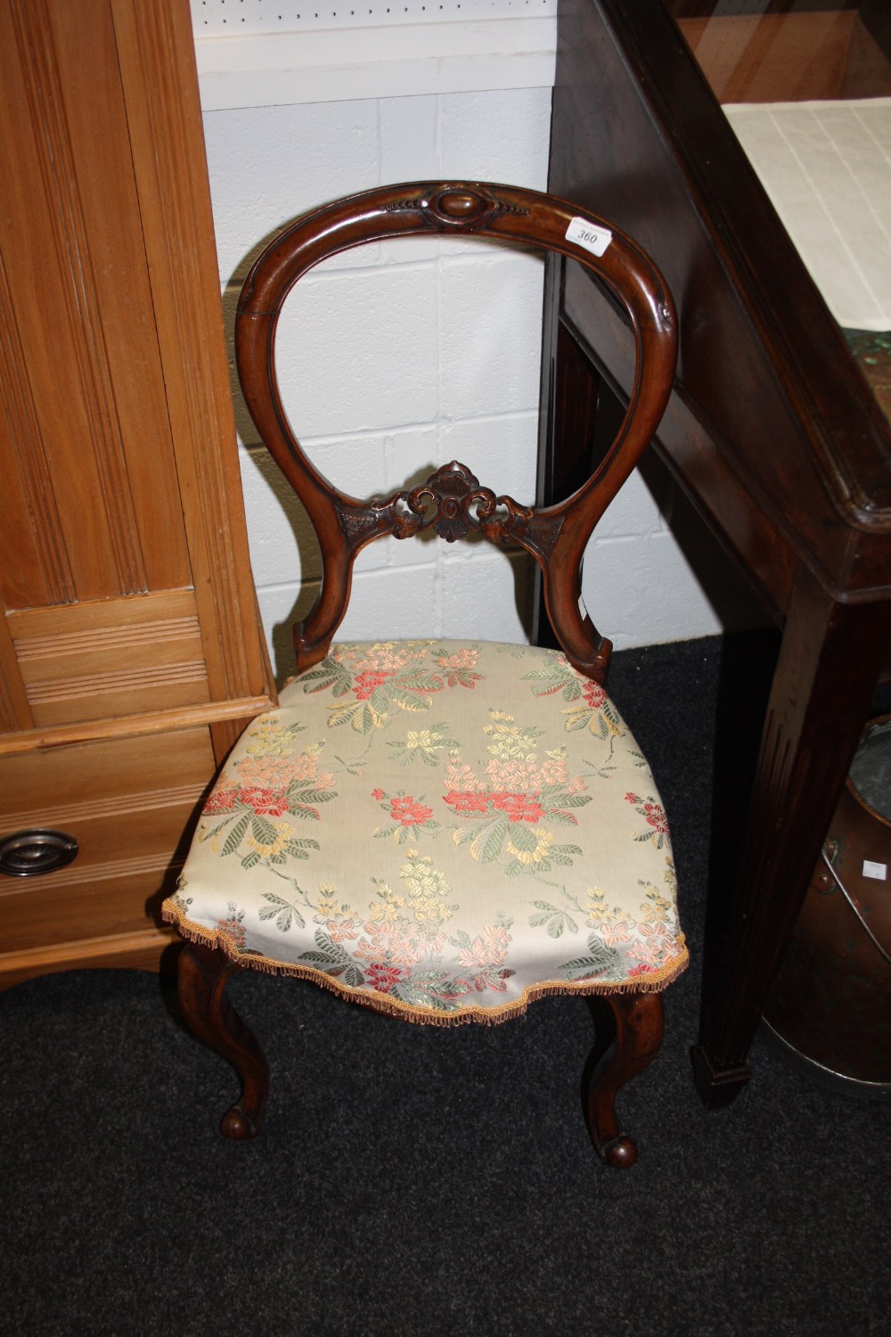 A Victorian mahogany balloon back chair