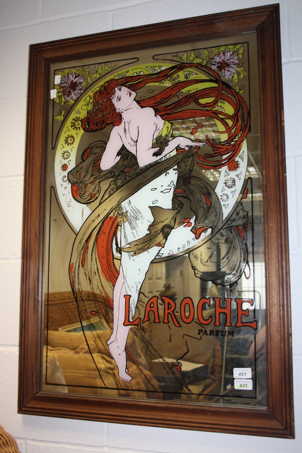 A large mirror, printed with Laroche, Parfum, framed