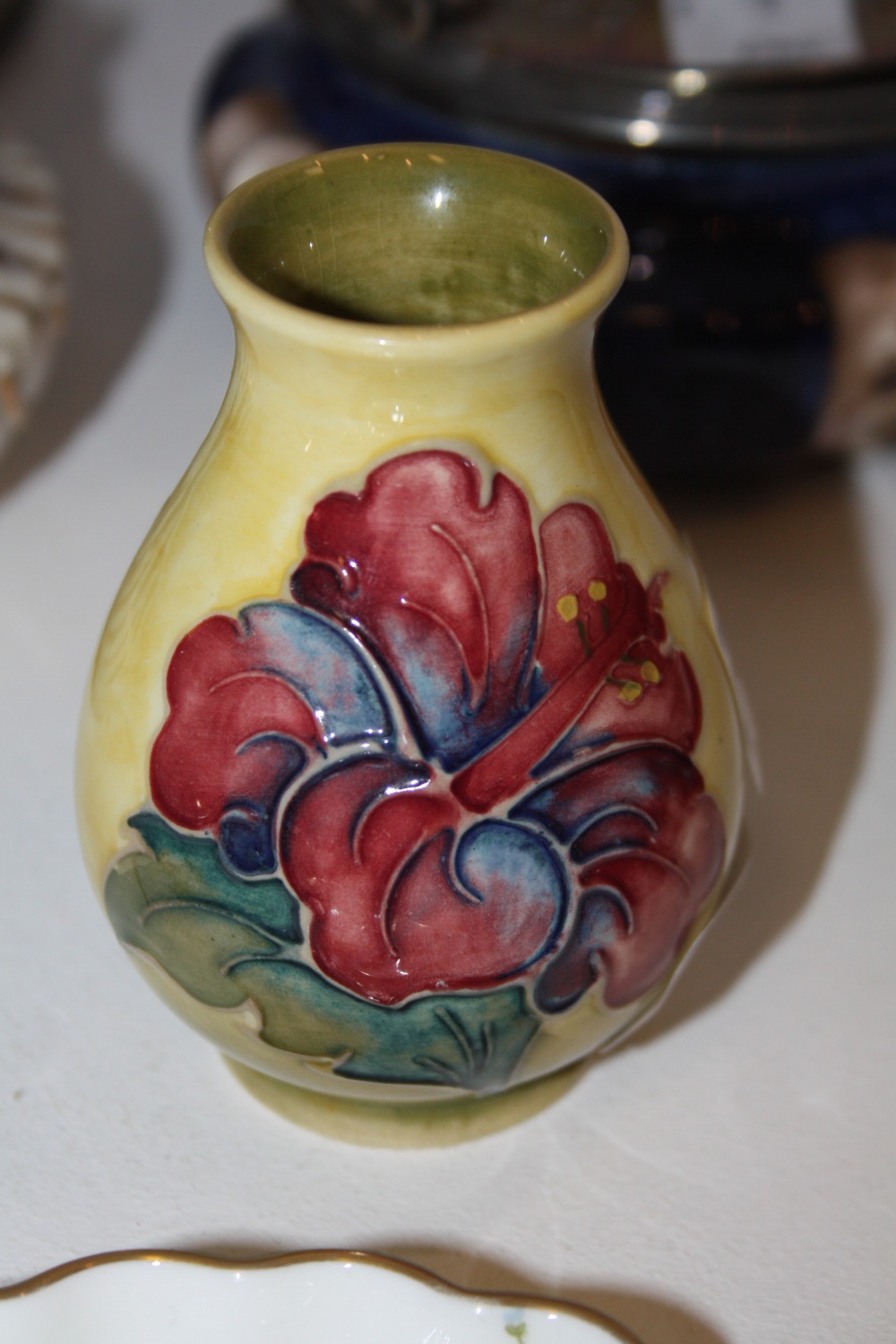 A Moorcroft hibiscus pattern baluster vase