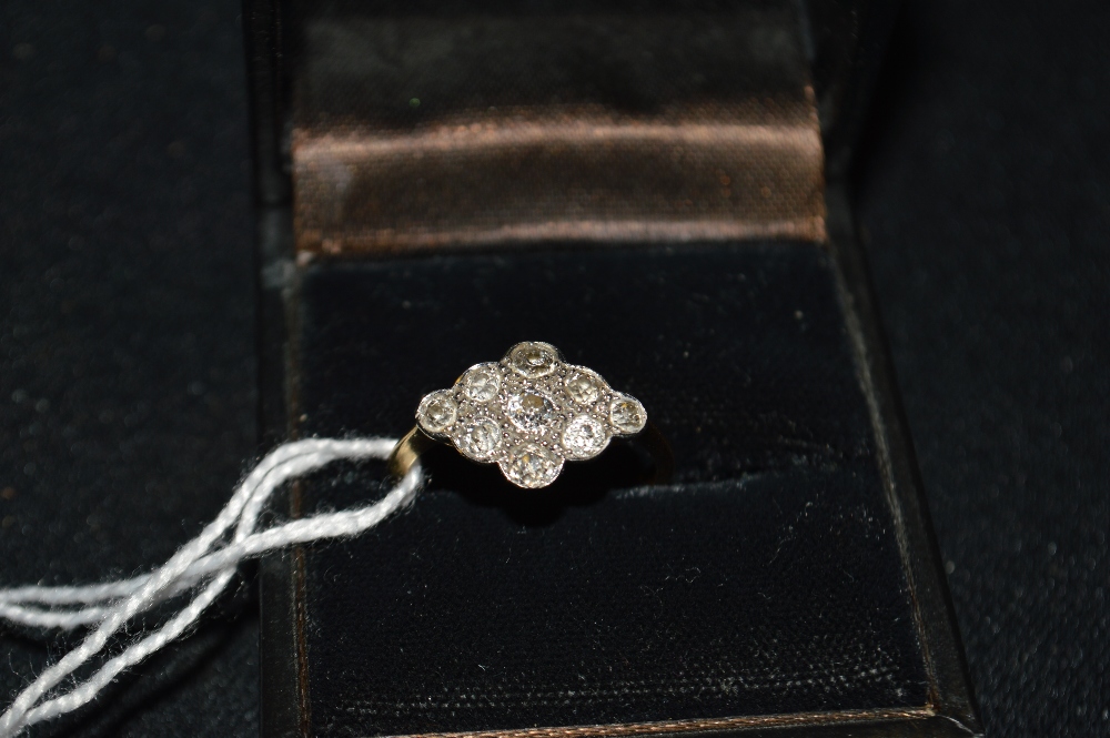 A Lady`s nine stone diamond ring, brilliant cut, 18ct. gold shank, 3g