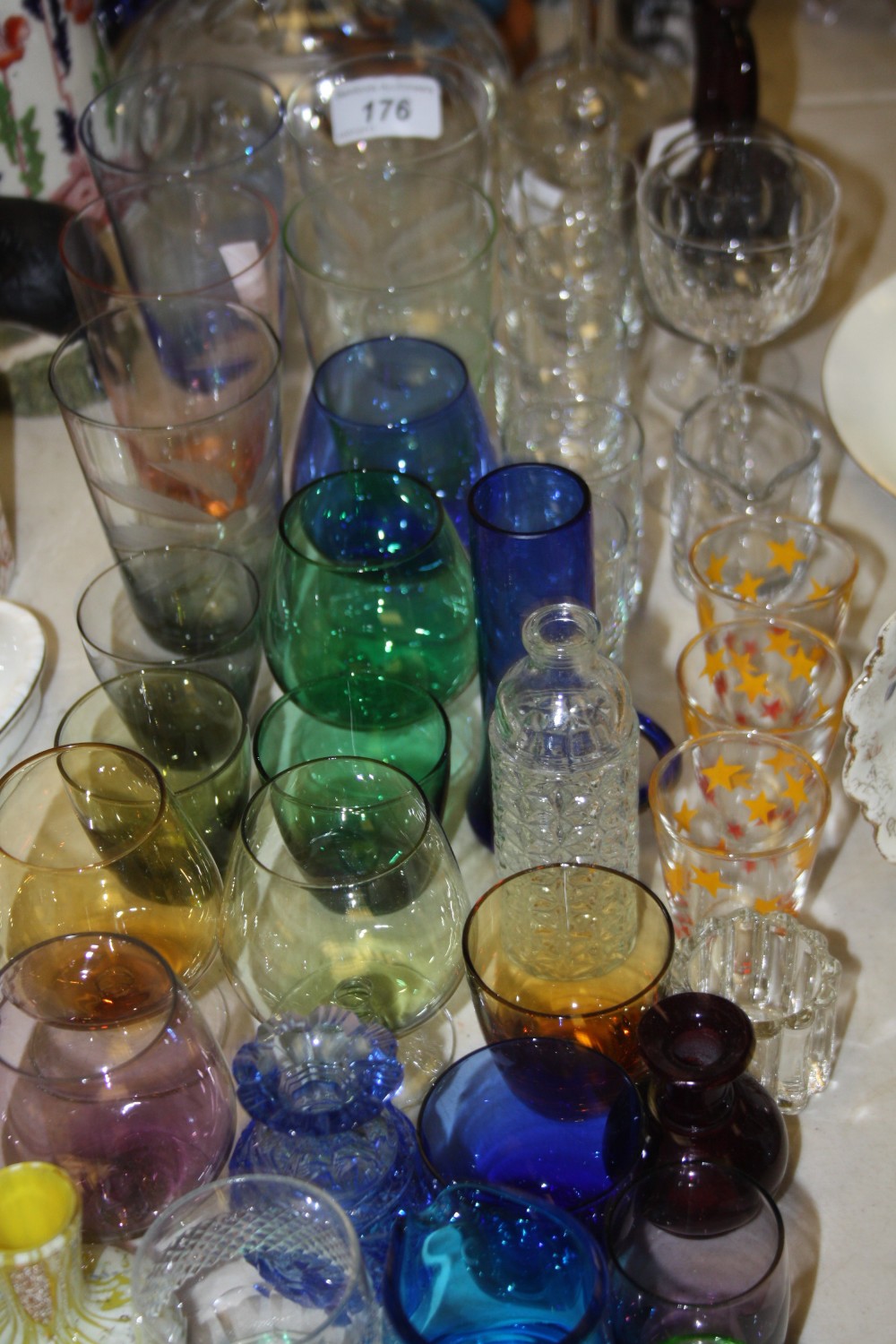 A miniature hand blown glass ovoid vase; a miniature blue cut glass vase; decanter; liqueur glasses;