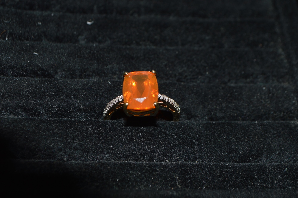 An 18ct gold Mexican fire opal, the shank set with diamond chips, size N, approximately 4g