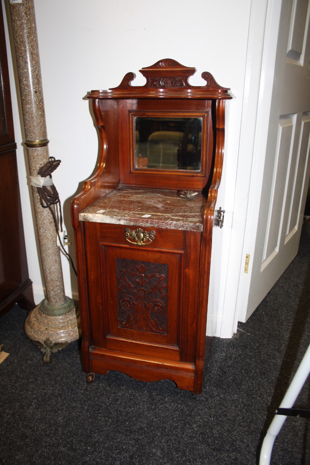 A Victorian mahogany carved coal cupboard with marble top