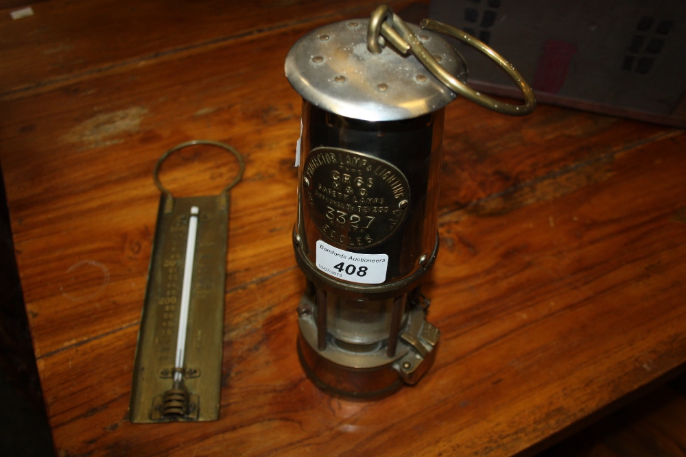 A 20th century miners lamp; brass thermometer