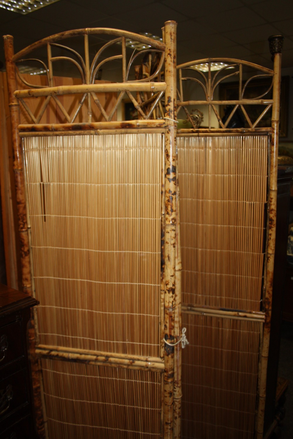 A bamboo three fold dressing screen