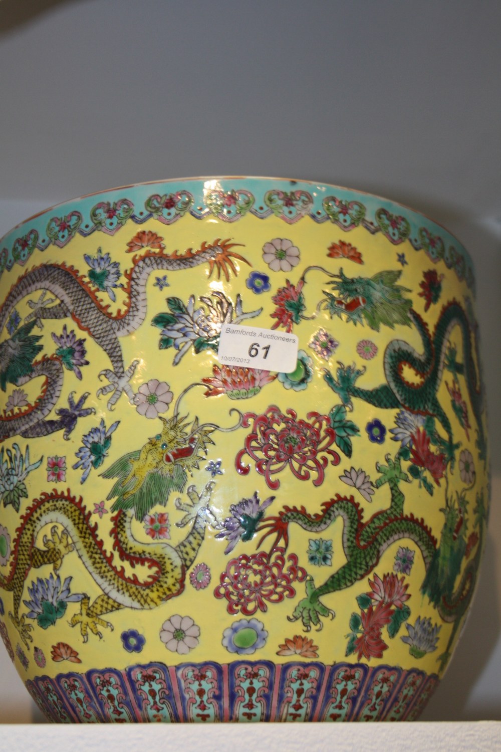 A Republican Period jardiniere, decorated with dragons on a yellow ground, six character mark