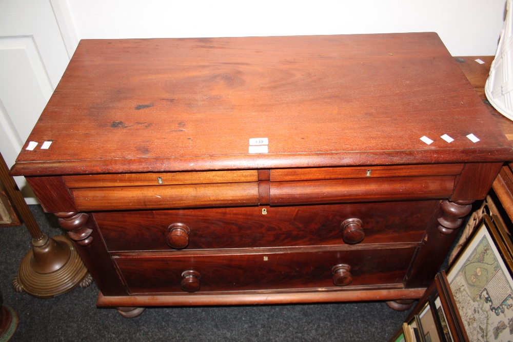 A `Victorian` mahogany and pine chest of drawers, two short over one long (faults)