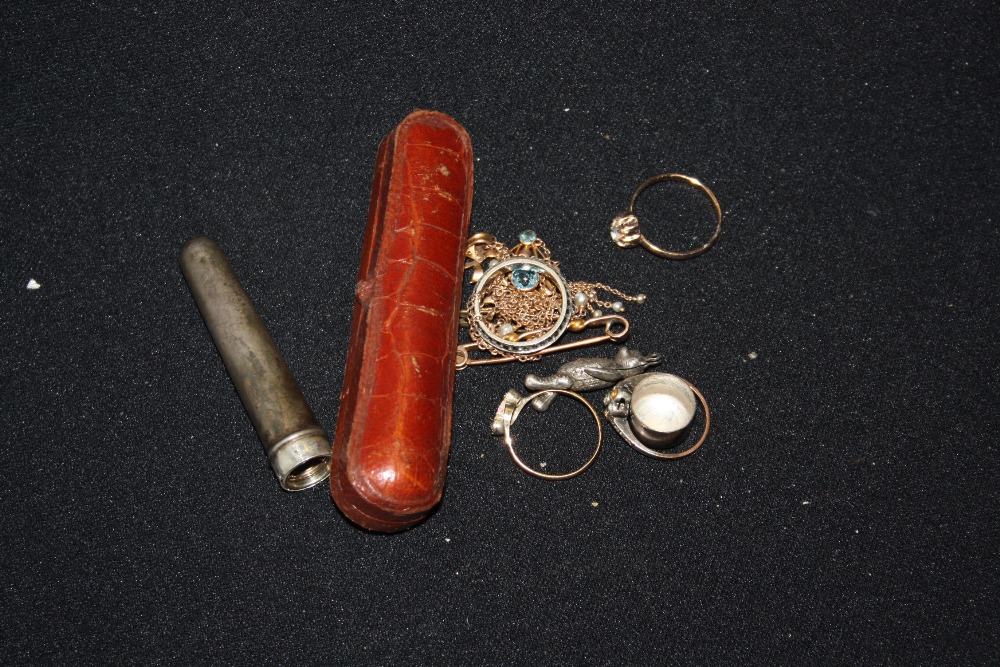 A 9ct gold and seed pearl pendant; a silver mounted cheroot holder; dress rings; etc