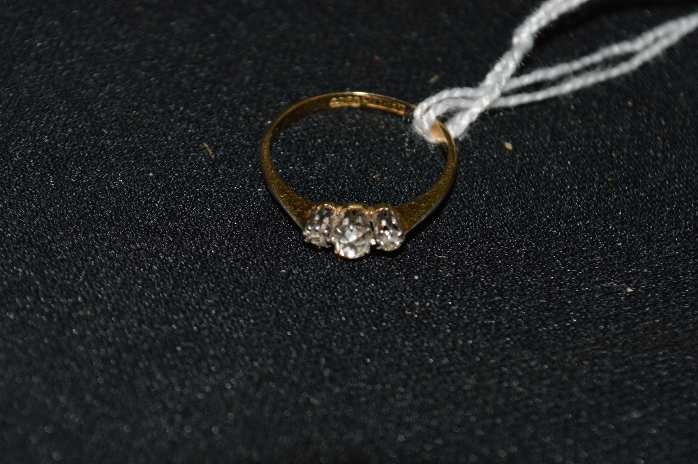 A three stone diamond ring, old cut, 18ct gold shank