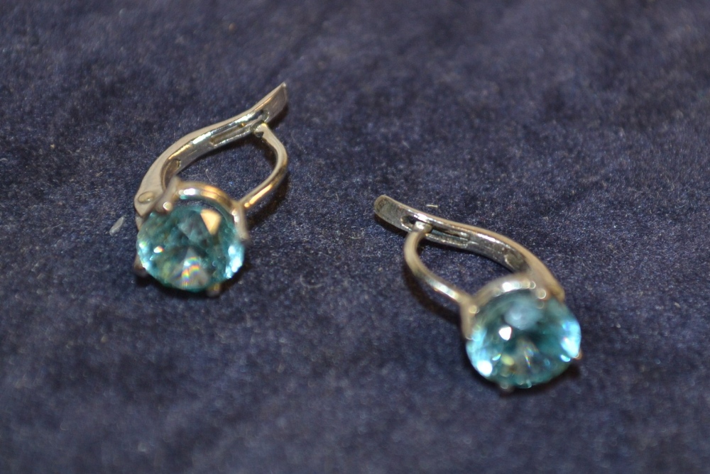 A pair of aqua marine earrings