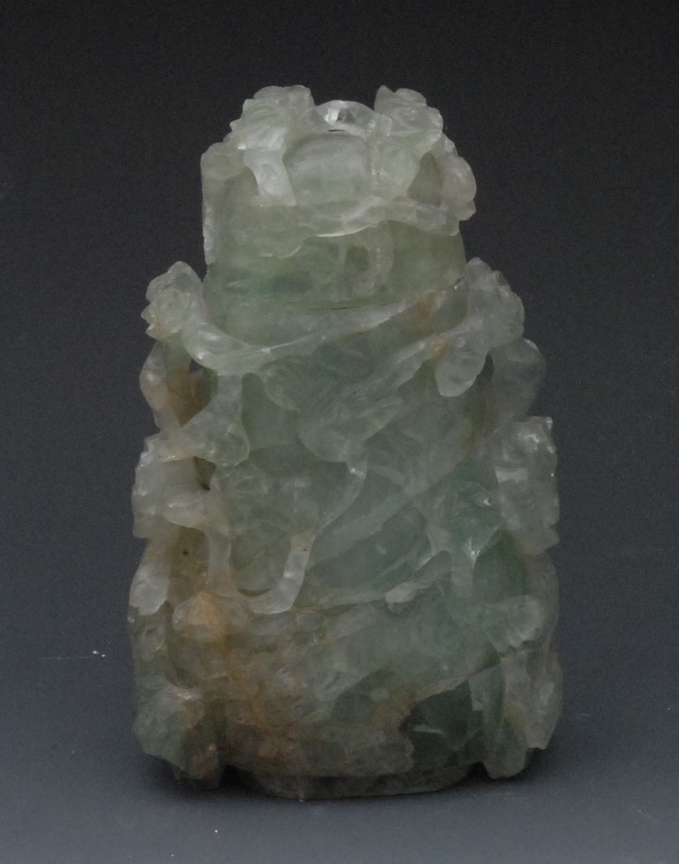 A Chinese `Jade` quartz carving, carved and pierced with blossoming prunus, 18cm high