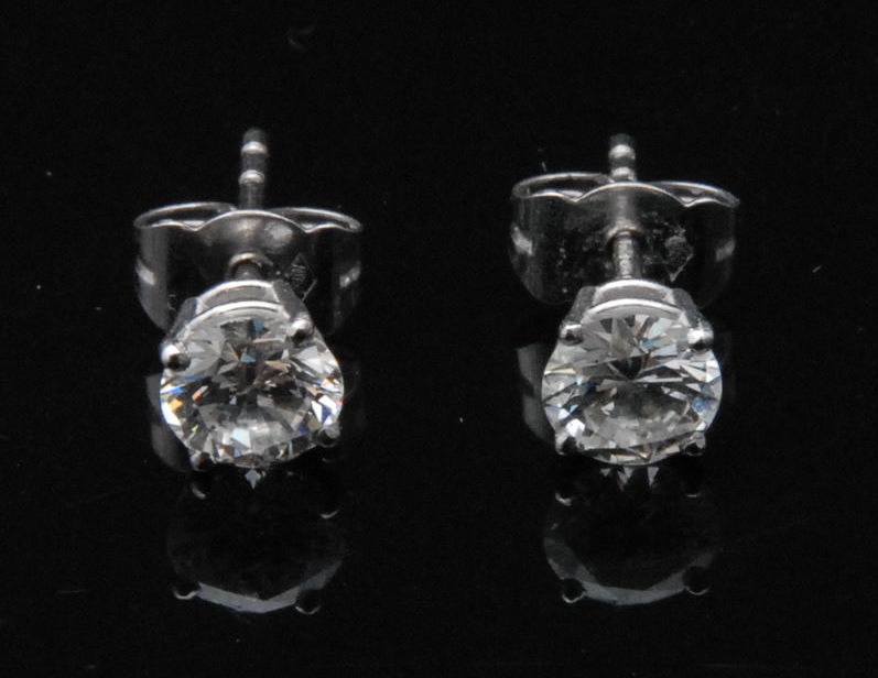 A pair of  lady`s diamond stud earrings, the round cut stones claw set, approx 1.1ct in total,