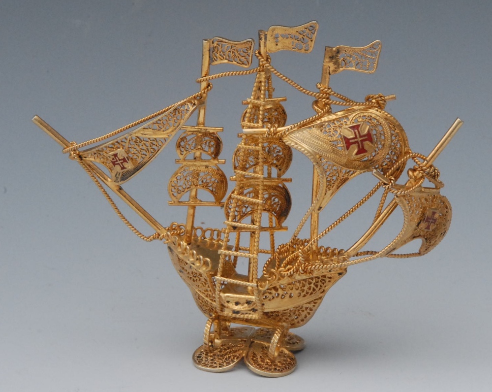 A Continental silver gilt filigree novelty miniature Nef, the sails decorated in red enamel with