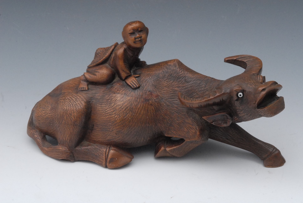 A Chinese carving, of a boy on the back of a buffalo, 24cm long, c.1900       Small loss to boy`s
