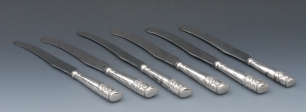 A set of six George III table knives, the hafts embossed with scrolling acanthus, maker`s mark only,