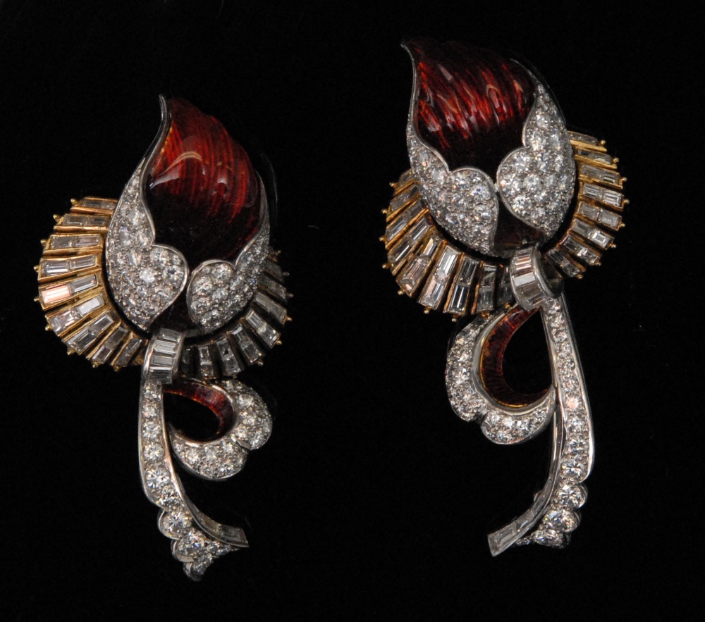 A pair of striking diamond and ruby enamel flower brooches, set with approx 7.5ct of baguette and