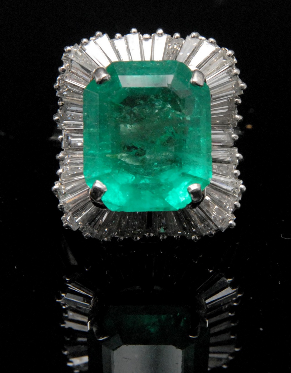 A diamond and emerald ballerina ring, the rectangular cut cornered set cut emerald, approx 12