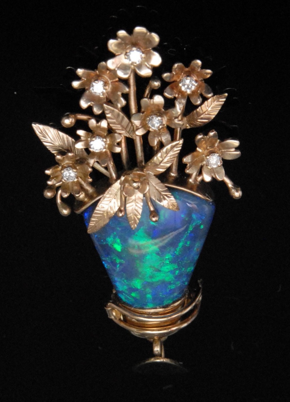 A diamond and black opal convertible pendant/brooch, as a vase of flowers, the petals set with seven