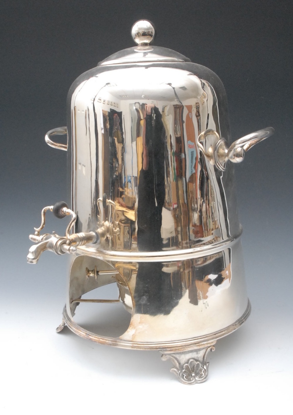 An E.P.N.S domed samovar and burner, spherical finial, shaped handles to sides, three-quarter