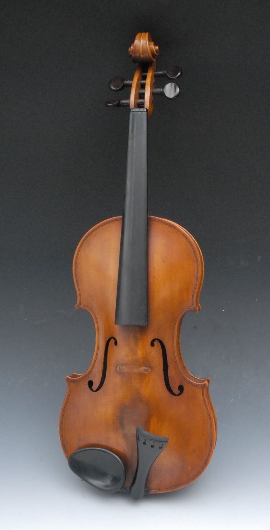 An English violin, the one-piece back 37cm to top of button, rosewood tuning pegs, ebony fret board,