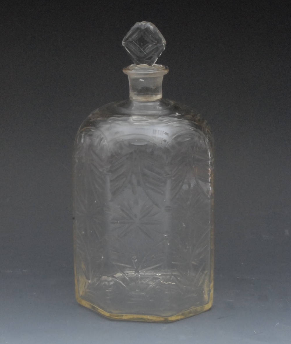 A 19th century hexagonal decanter and stopper, wheel cut with stylised flowerheads, 26cm high