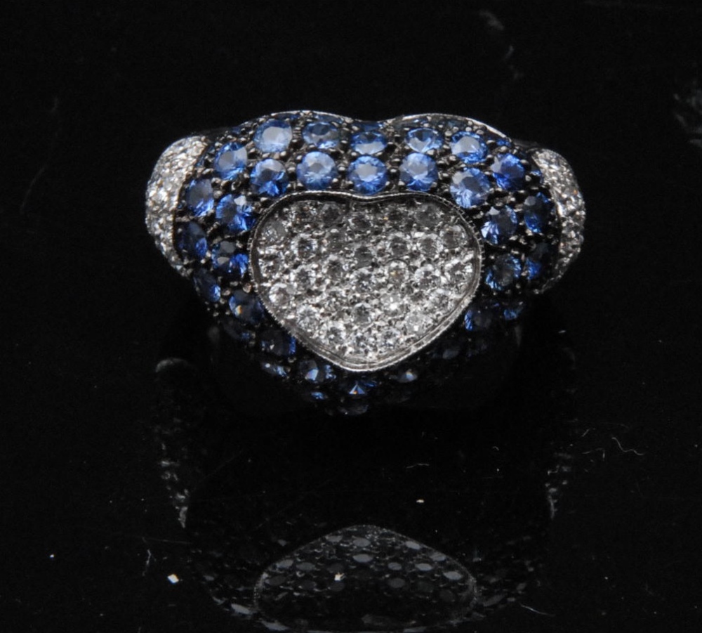 An impressive sapphire and diamond set 18ct gold dress ring, the heart shaped ring with diamond