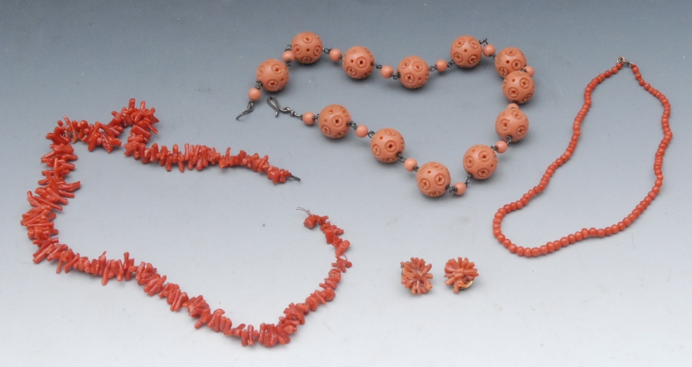 A coral necklace, 43cm long; another, with twelve pierced spheres, 41cm long; others (qty)