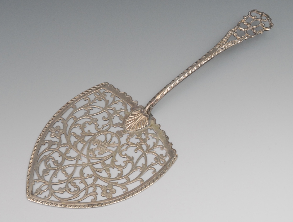 A George III pierced slice, the blade worked with a bird, flowers and tendrils, engraved armorial