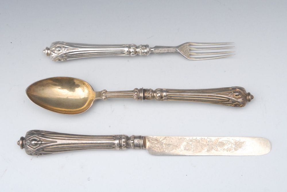 A Victorian silver-gilt three piece Christening set, comprising knife, fork and spoon, engraved with